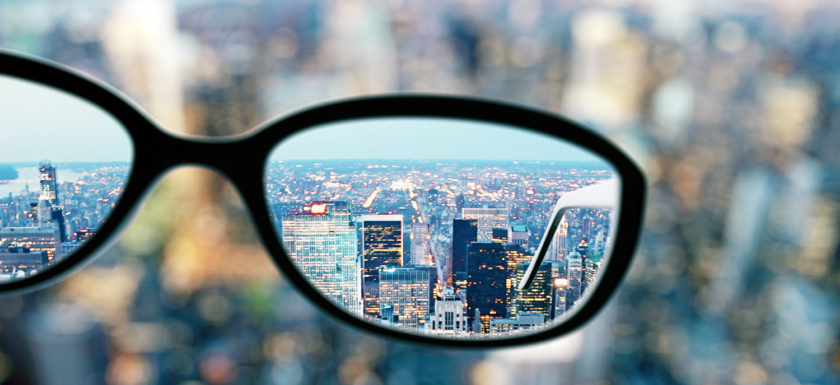 Close up of glasses on blurry city background. Clean vision concept. 3D Rendering