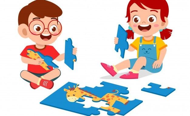 little boy and girl doing puzzle together